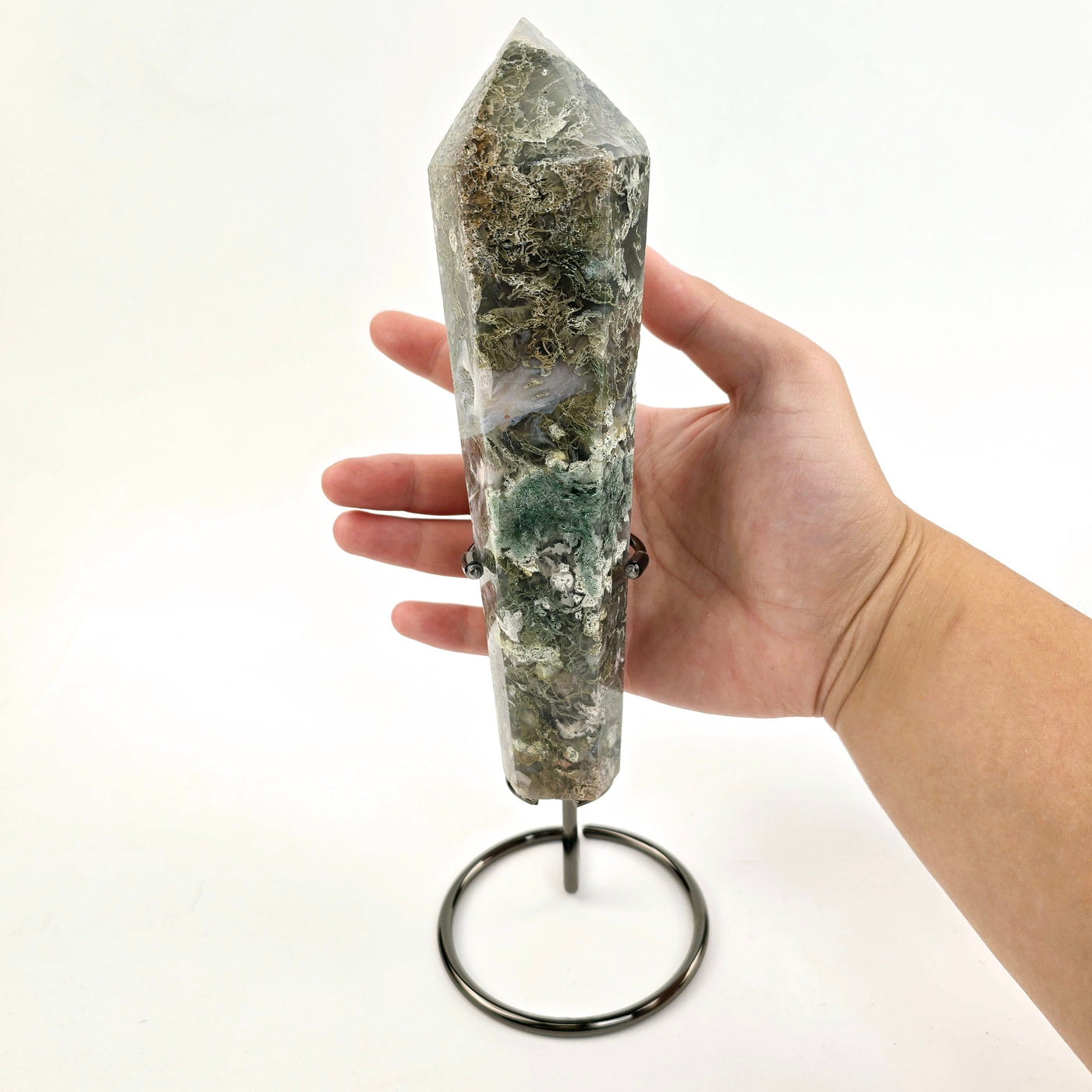 Moss Agate Wand on Stand 3 with hand for size reference