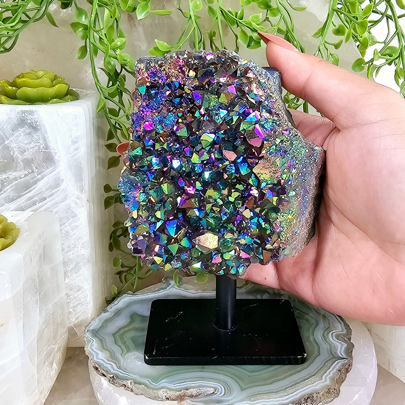 Titanium Coated Amethyst Cluster on Stand with hand for size reference