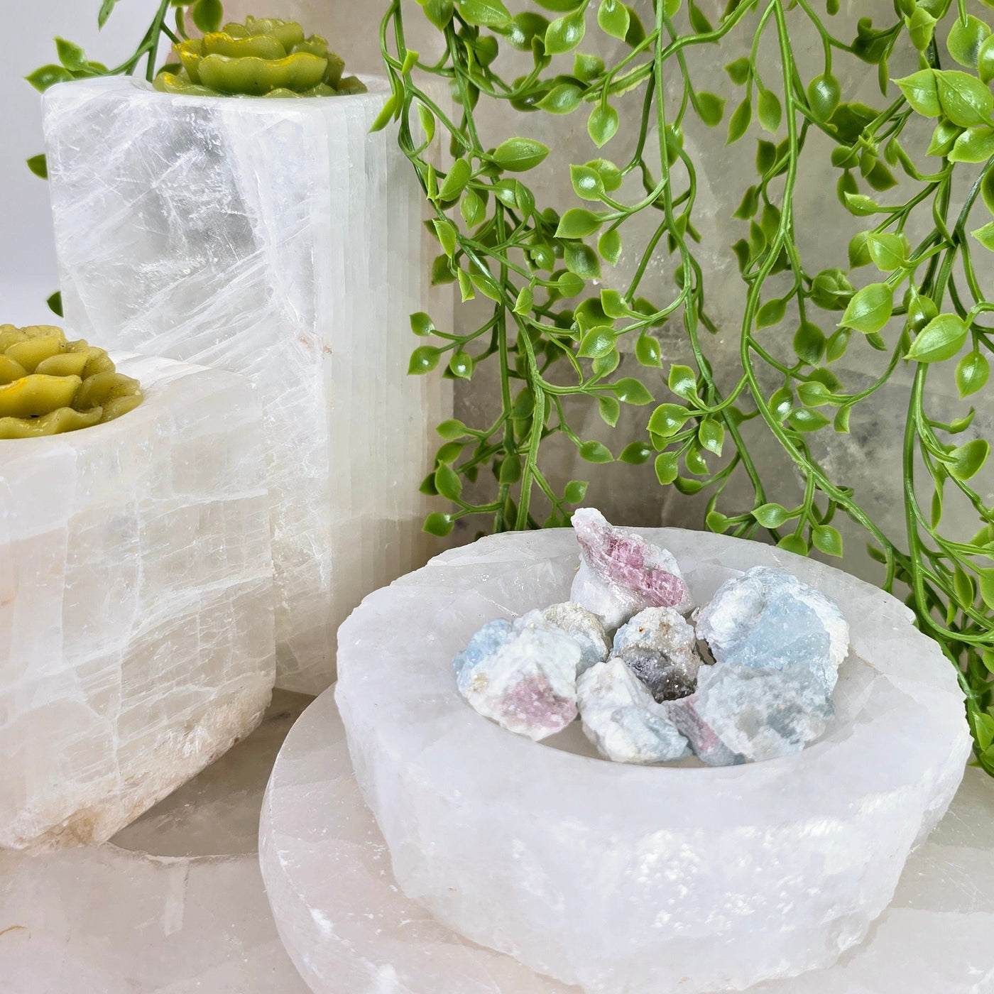 Pink Tourmaline on Aquamarine Matrix - in bowl with candle holders and plants in background