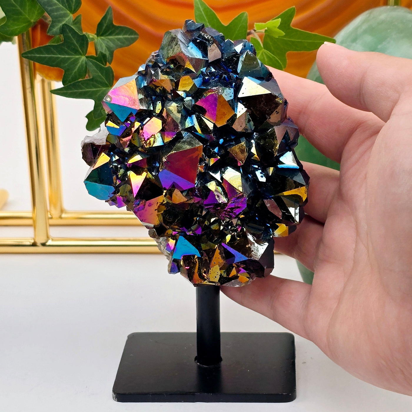 Titanium Coated Amethyst Cluster on Stand 2 with hand for size reference