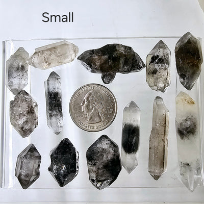 Tibetan Quartz - Double-Terminated Crystal Points - By Size Small variants with quarter for size reference labeled