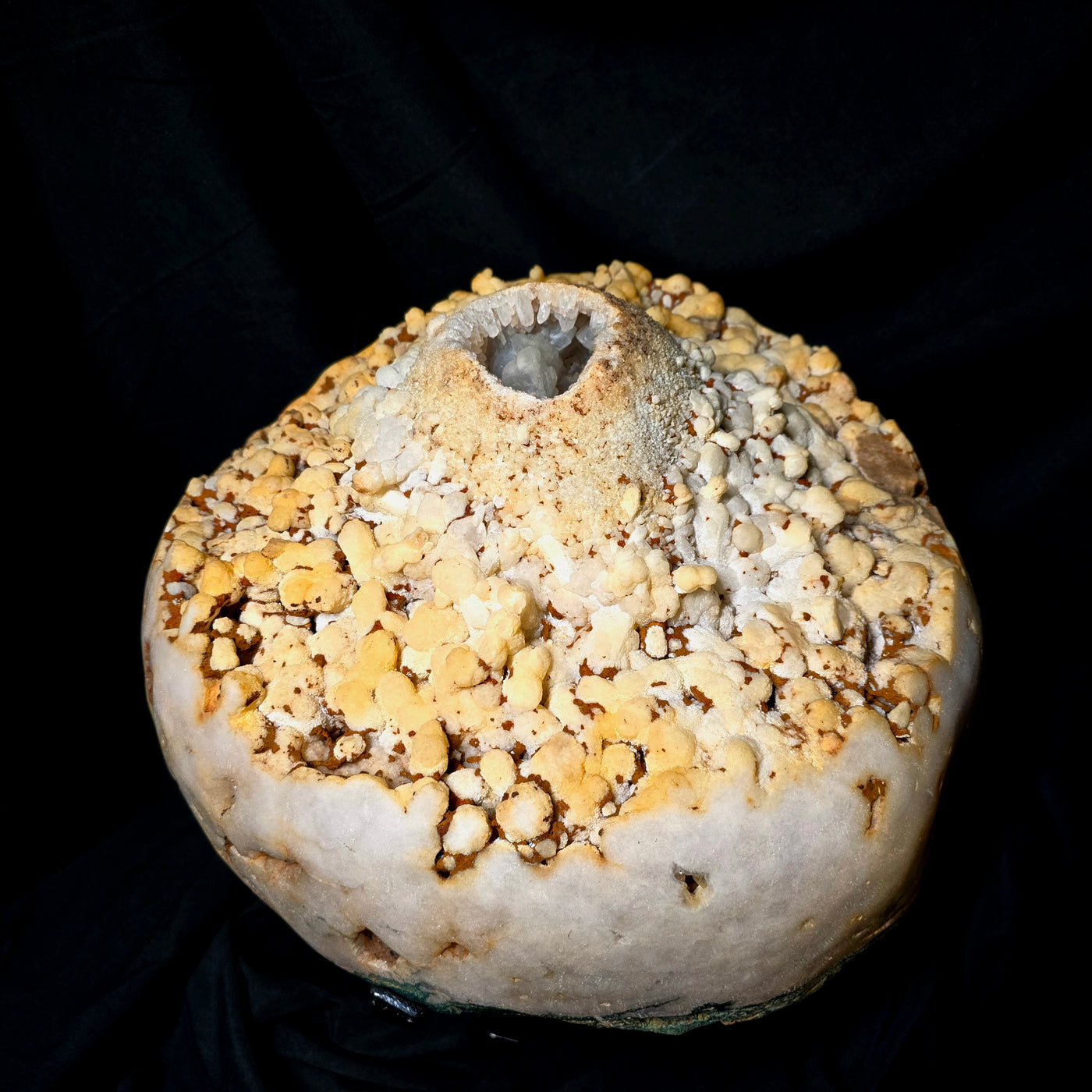 High-Grade Pink Amethyst Crystal Geode on Rotating Stand front view with black background