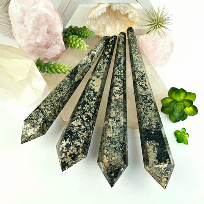 Pyrite Crystal Wands - You Choose all variants arranged on quartz platter with plants and props in the background