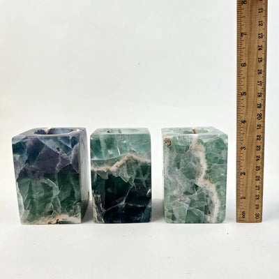 Fluorite Crystal Candle Holder - AA Grade three next to ruler for size reference