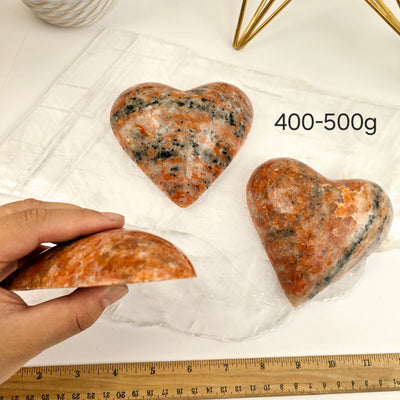 Large Orchid Calcite Polished Heart - By Weight 400-500g labeled with hand and ruler for size reference