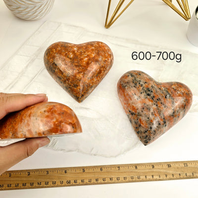 Large Orchid Calcite Polished Heart - By Weight 600-700g labeled with hand and ruler for size reference