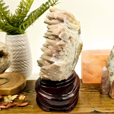 Pink Calcite Crystal Cluster with Wooden Stand side view