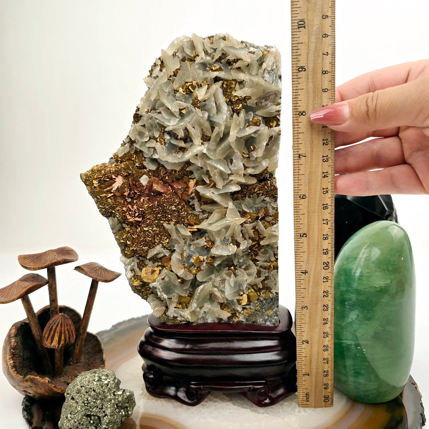 Pyrite and Calcite Crystal Cluster with Wooden Stand #1 with hand holding ruler for size reference