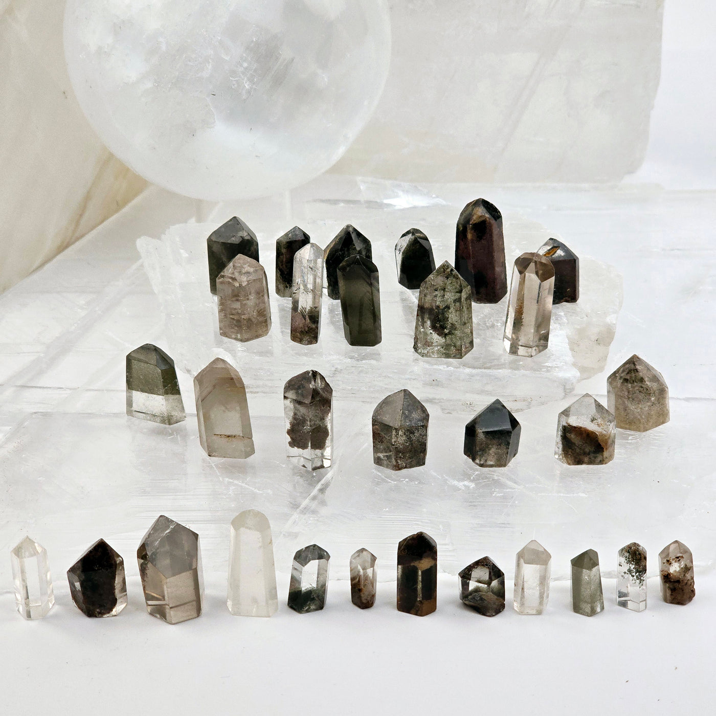 Lodalite - Garden Quartz - Small Polished Crystal Points various lodalite crystals standing on selenite platters