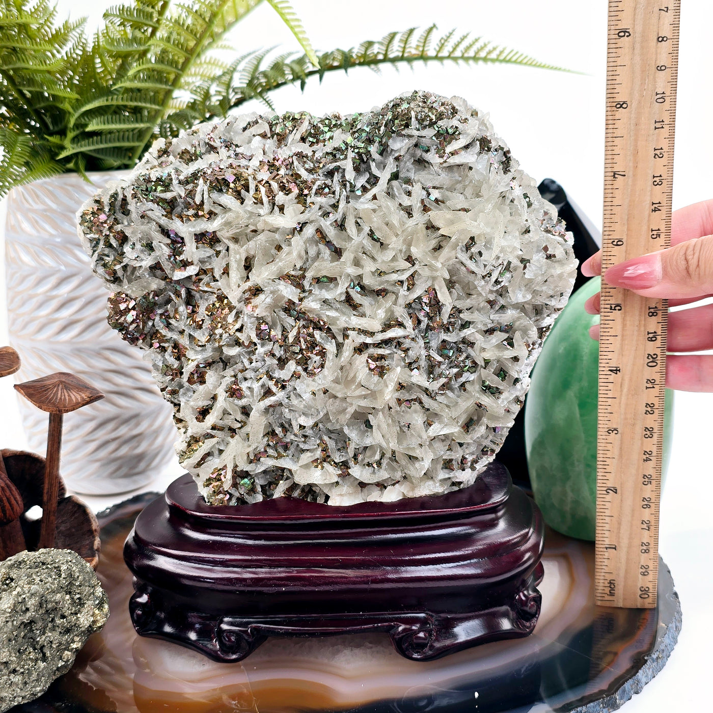 Pyrite and Calcite Crystal Cluster with Wooden Stand #2 front view with ruler and hand for size reference