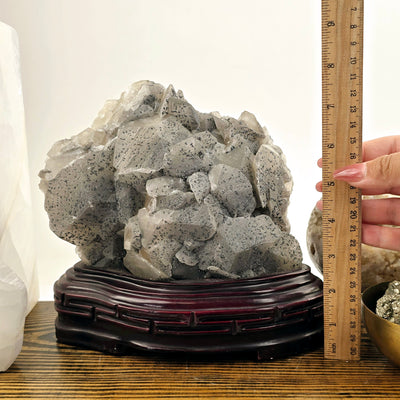 Calcite and Stibnite Crystal Cluster with Wooden Stand with ruler and hand for size reference