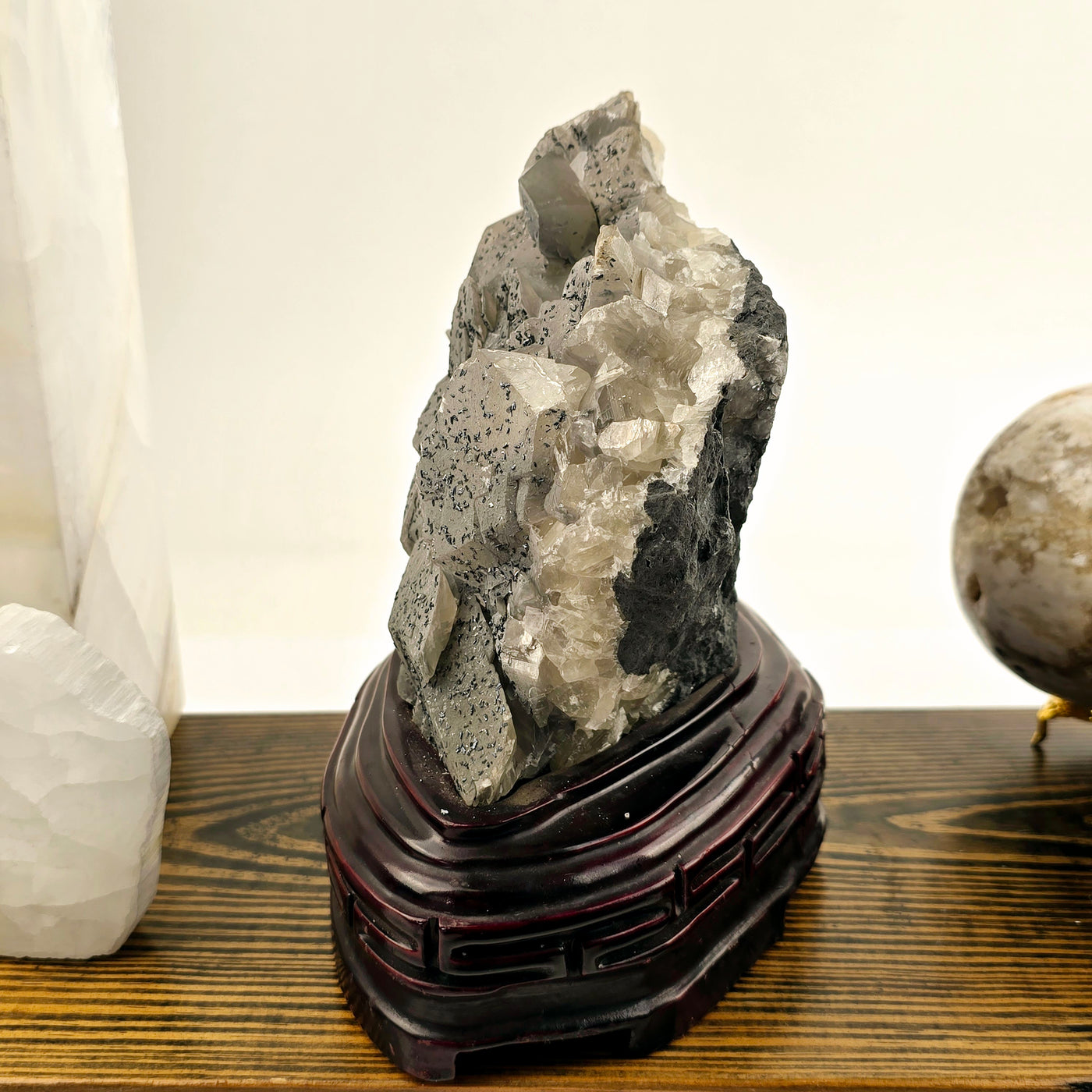 Calcite and Stibnite Crystal Cluster with Wooden Stand side view