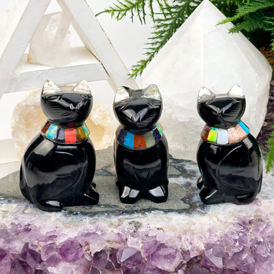  Black Onyx Crystal Cat with Shell and Gemstone Inlays - You Choose - all variants on amethyst platter with props and plants in the background