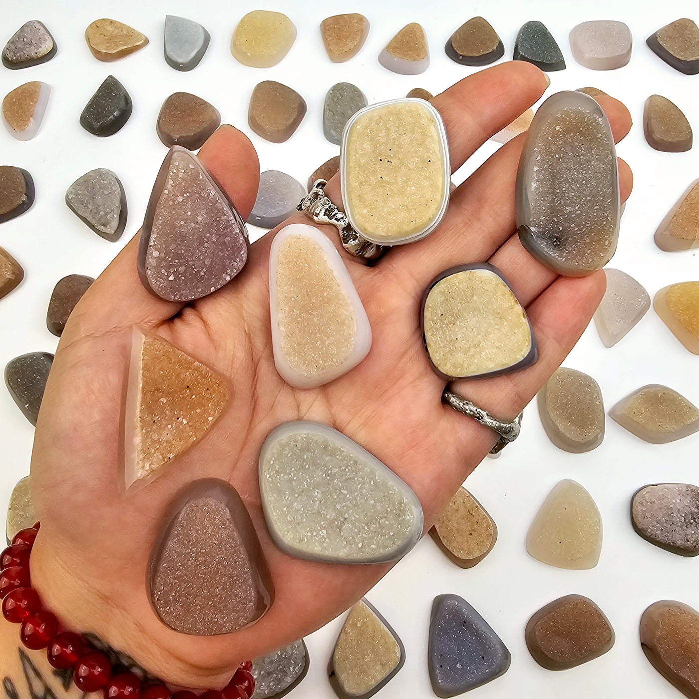 Natural Agate Druzy Freeform Cabochon - High Quality in hand for size reference with other cabochons in the background