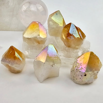 Angel Aura Citrine Semi Polished Crystal Point - By Weight both variants shown on selenite platter with quartz sphere in the background