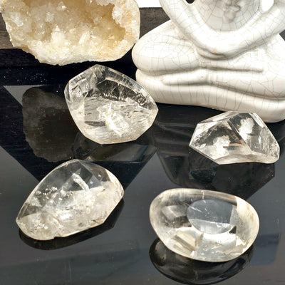 Polished Crystal Quartz Lens with Manifestations - You Choose - all variants with props in the background