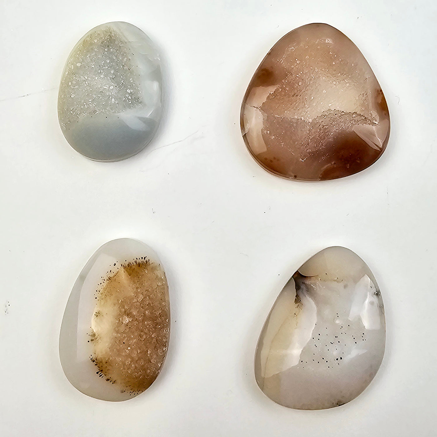 Natural Agate Druzy Cabochons - Lot of 16 - You Get All #3 - four cabochons of different shapes on white background