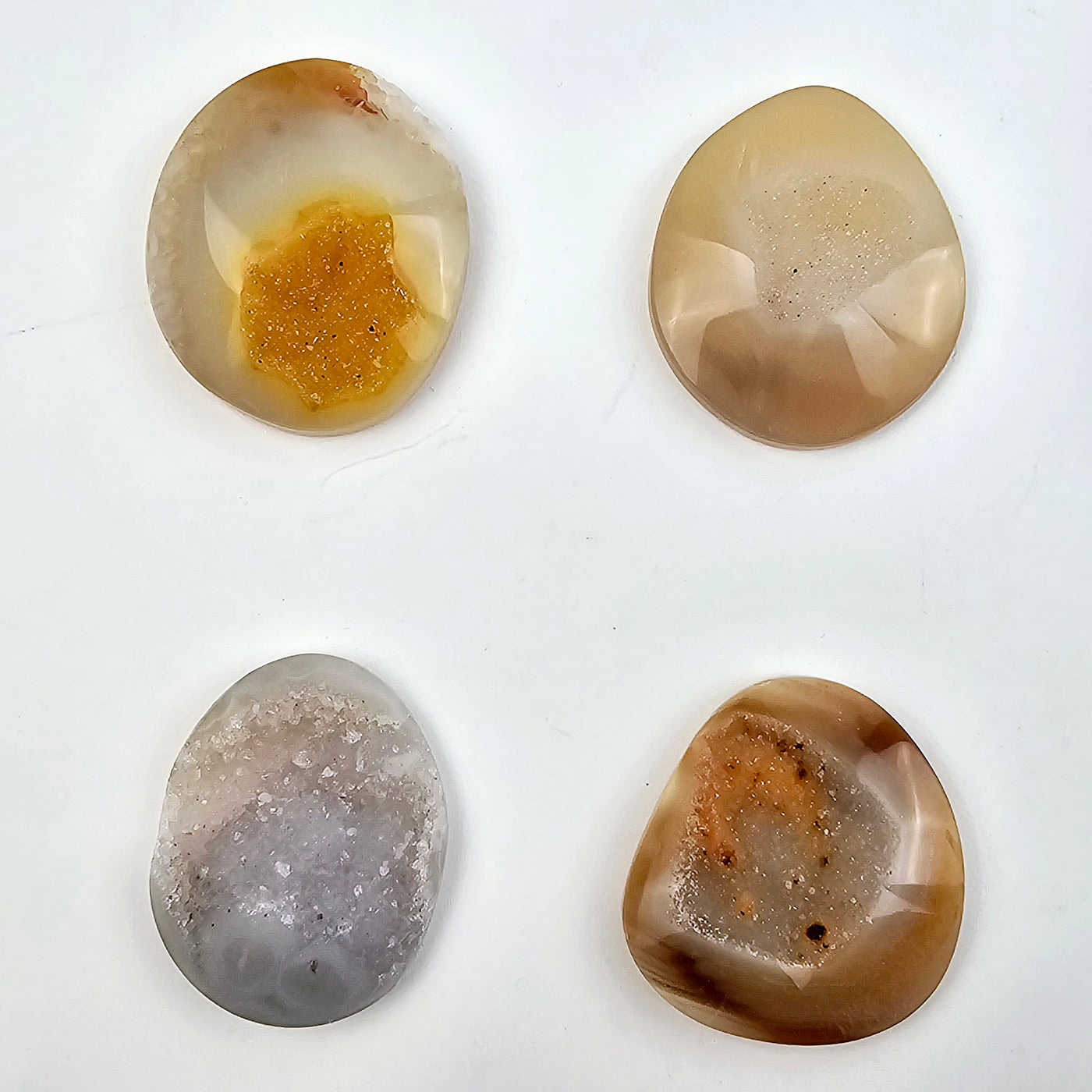 Natural Agate Druzy Cabochons - Lot of 16 - You Get All #3 - four cabochons of different shapes on white background