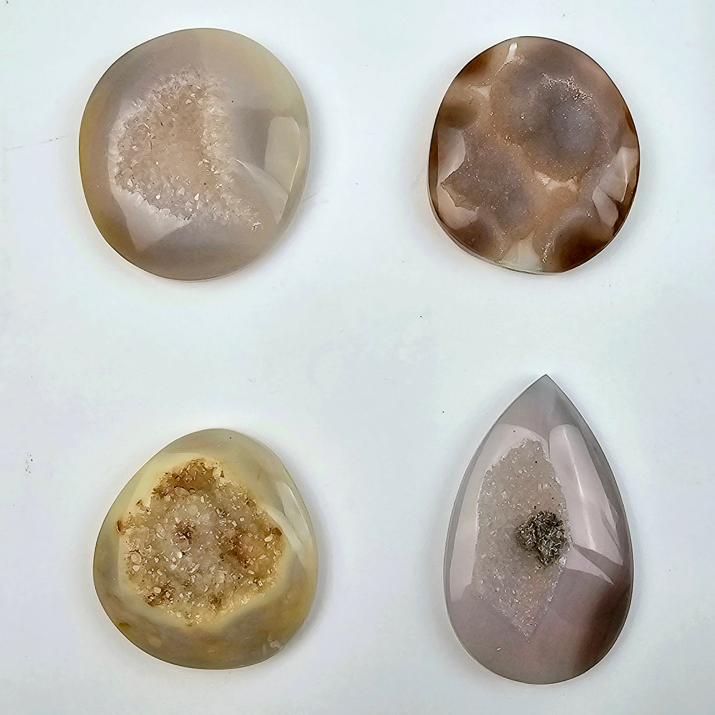 Natural Agate Druzy Cabochons - Lot of 16 - You Get All #3 - four cabochons of different shapes on white background