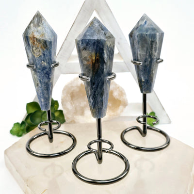 Blue Kyanite - Small Crystal Wand on Stand - You Choose - all variants on stone platter with props and plants in the background