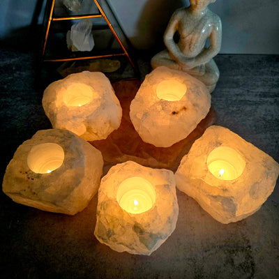 5 Crystal Quartz Candle Holders, "B" Quality, looking down into the lit candle holder
