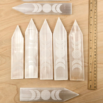 Selenite Charging Plate Engraved with Flower of Life Moon Phase Design -  8" Pointed Stick seven shown with ruler for size reference