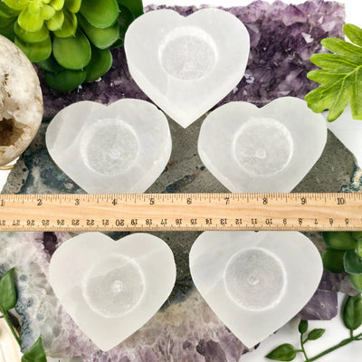 Smaller Selenite Heart Shaped Candle Holder top view with ruler for size reference no candles