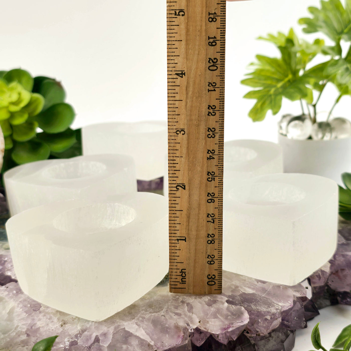 Smaller Selenite Heart Shaped Candle Holder side view with ruler for size reference no candles