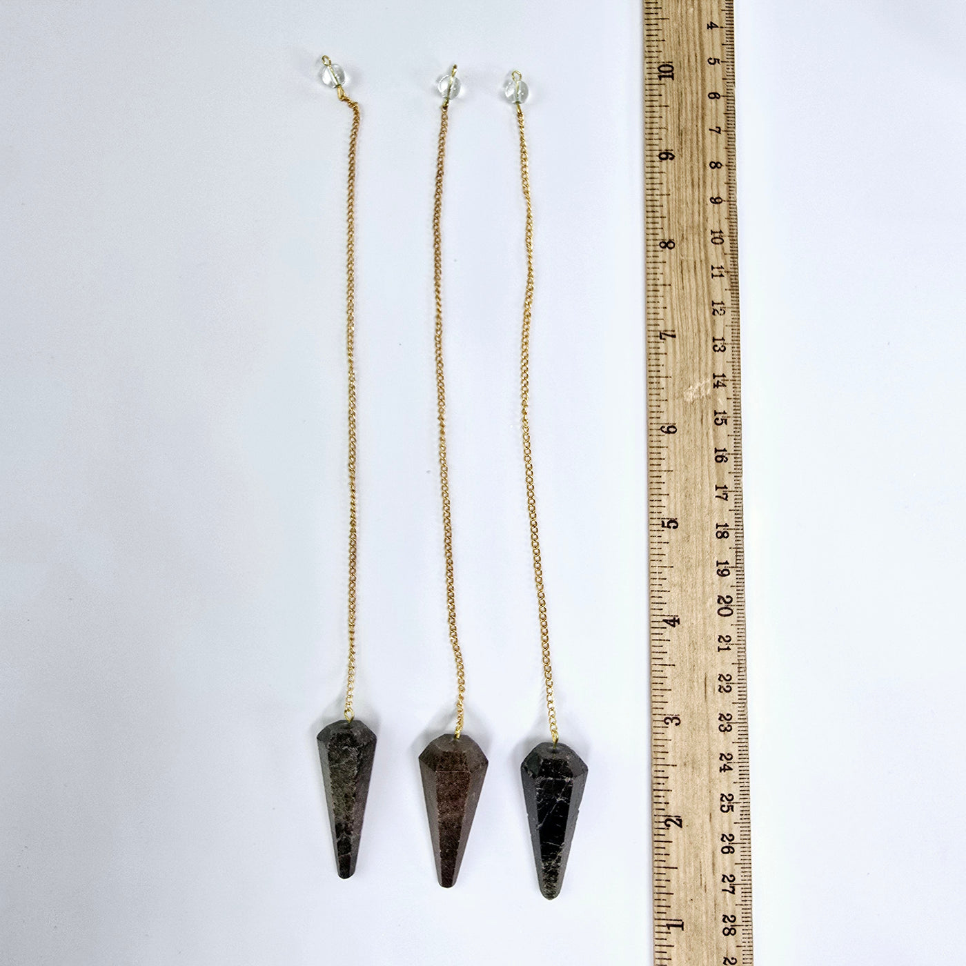 Garnet Crystal Pendulum with Gold Plated Bail and Chain - three with a ruler for size reference