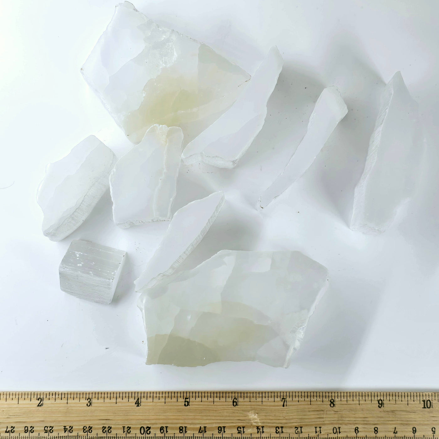 all selenite slabs with ruler for size reference