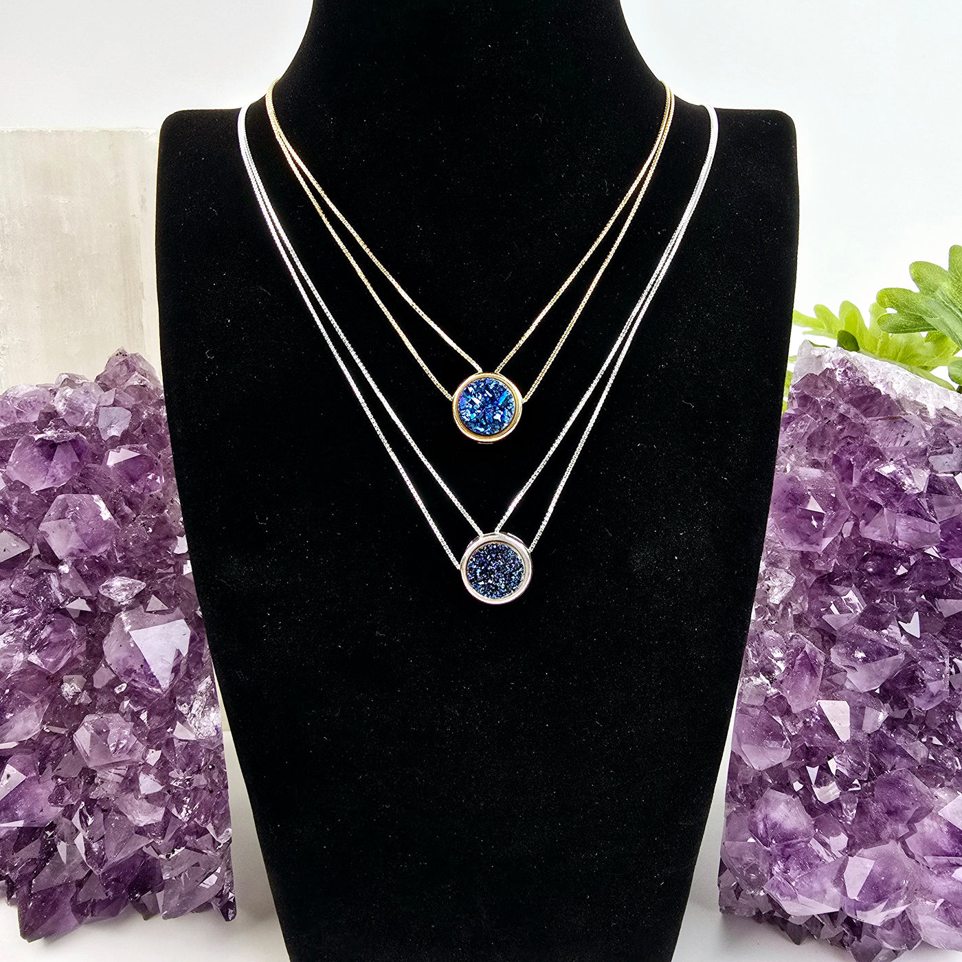 Mystic Blue Druzy Double Chain Necklace - You Choose Finish - both finishes of necklaces on black necklace stand with amethyst and plants in the background