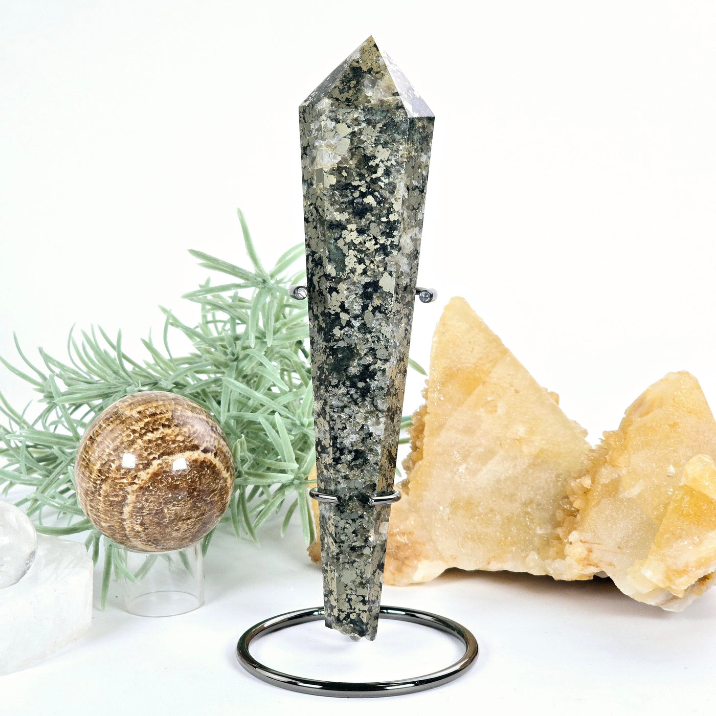 Pyrite Crystal Wand on Stand - One-of-a-Kind front view with props and plants in the background