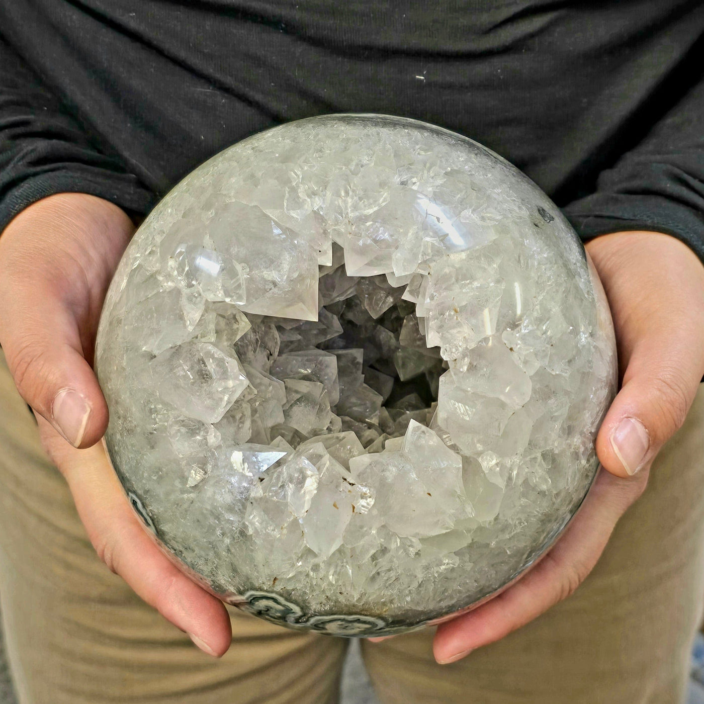 Light Amethyst Large Crystal Sphere One-of-a-Kind in hands for size reference