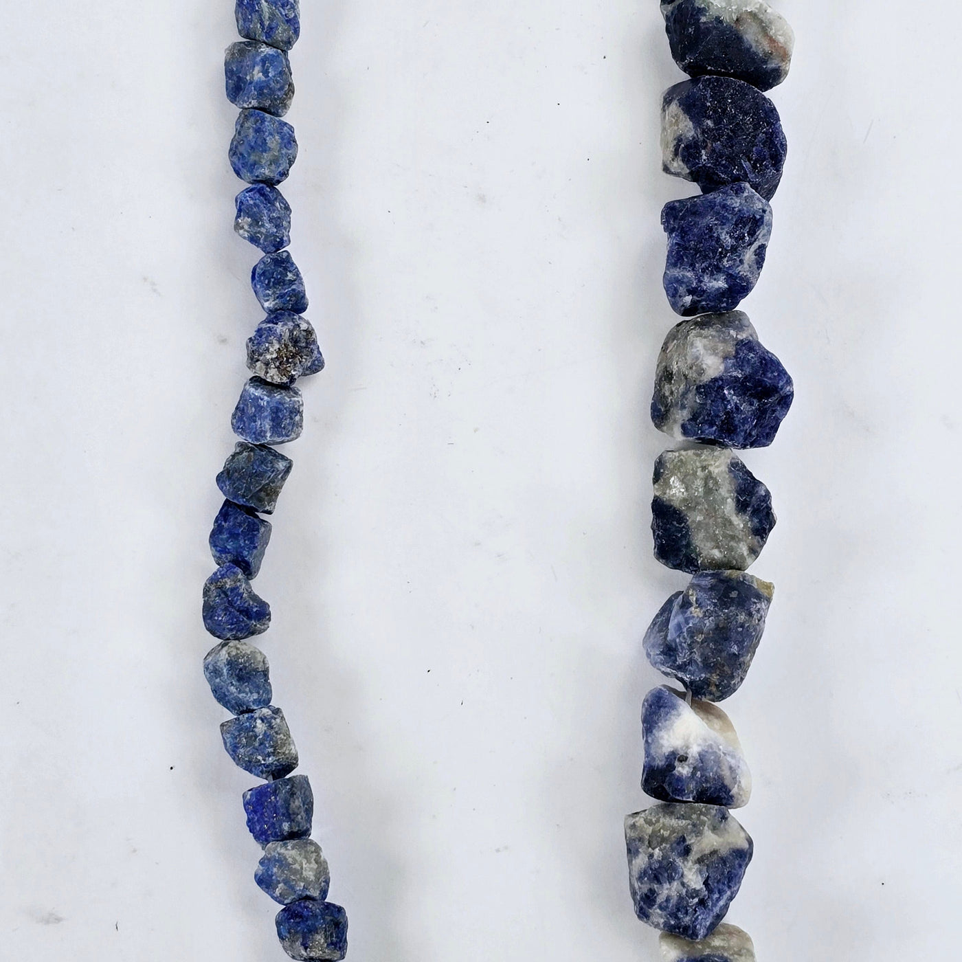 Rough Sodalite Crystal Beads - Full Strand - You Choose Size a single strand of each size on white background