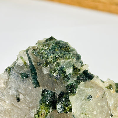 tourmaline with decorations in the background