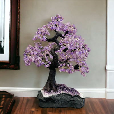 amethyst tree on amethyst base with decorations in the background