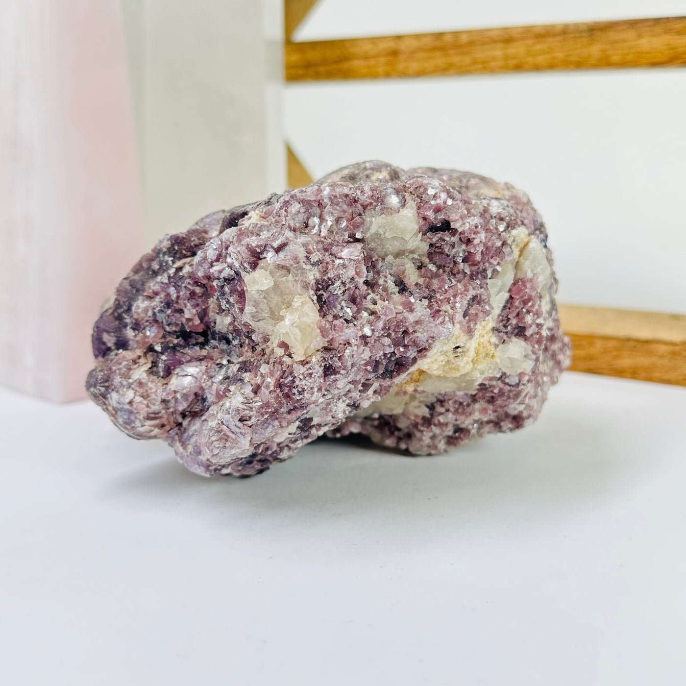 lepidolite with decorations in the background