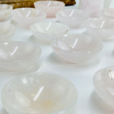 mini rose quartz bowls on white background