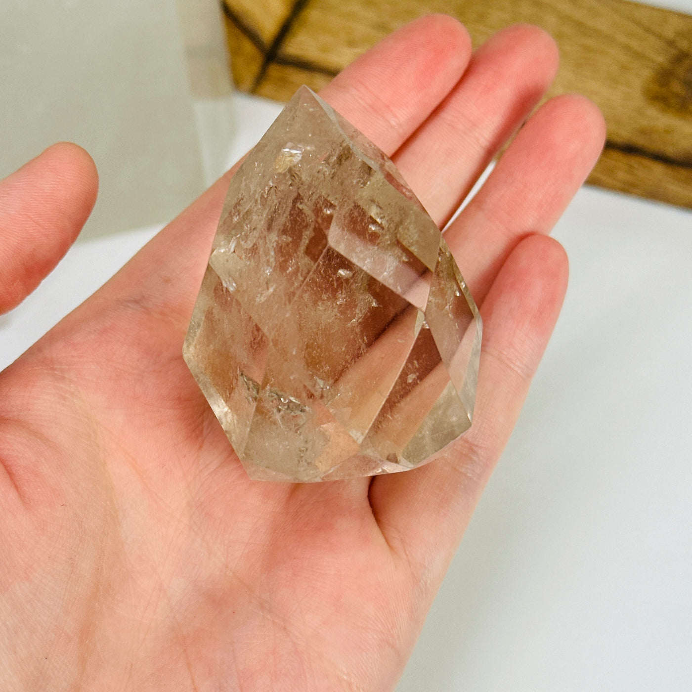 crystal quartz egg with decorations in the background