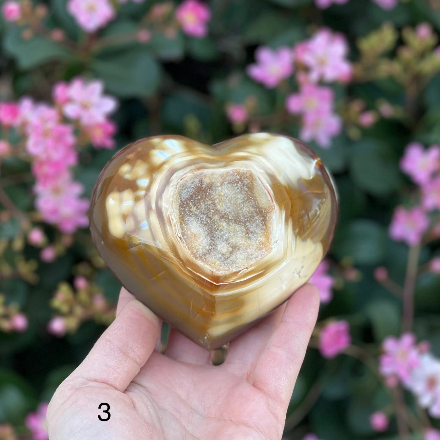 agate heart with decorations in the background