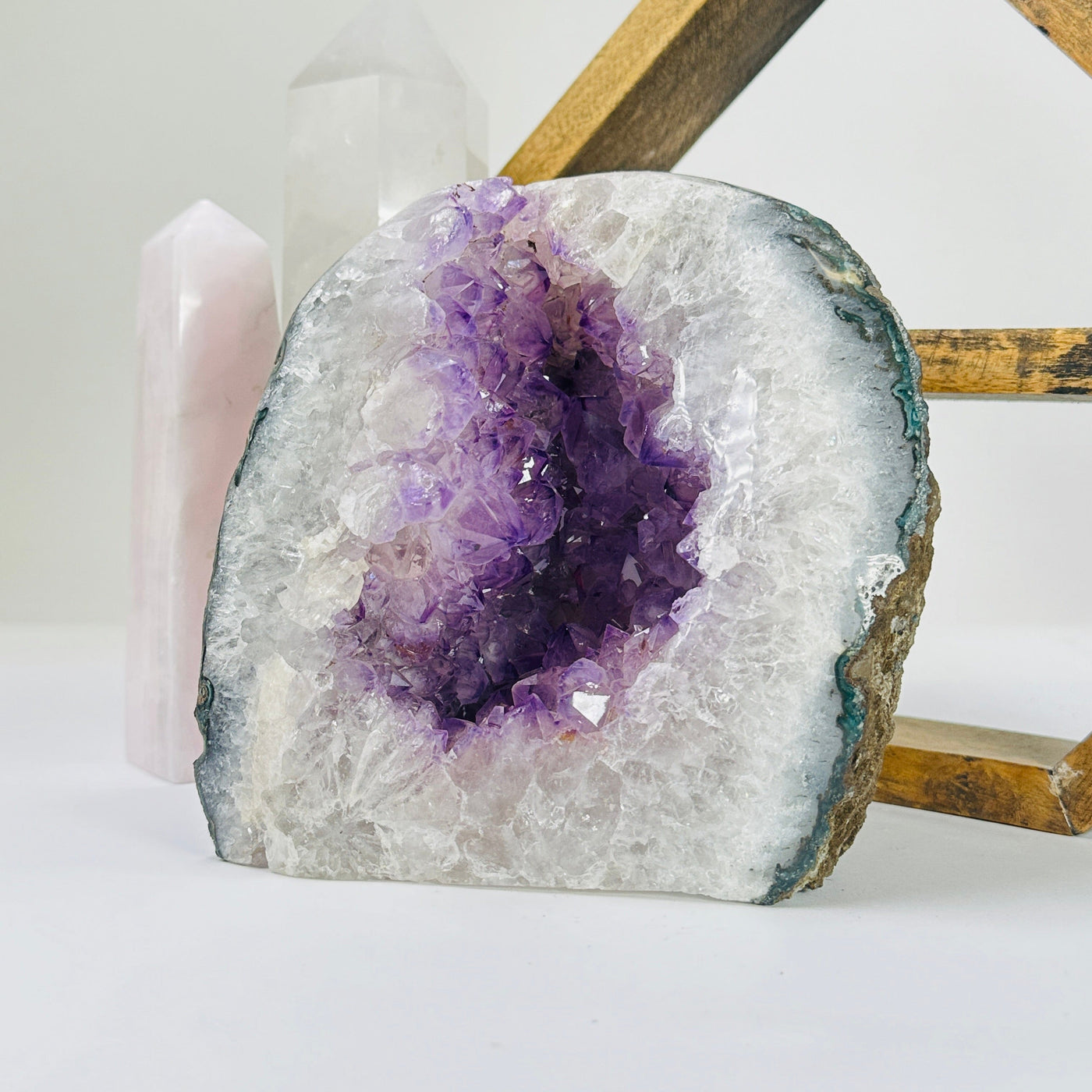 amethyst geode with decorations in the background