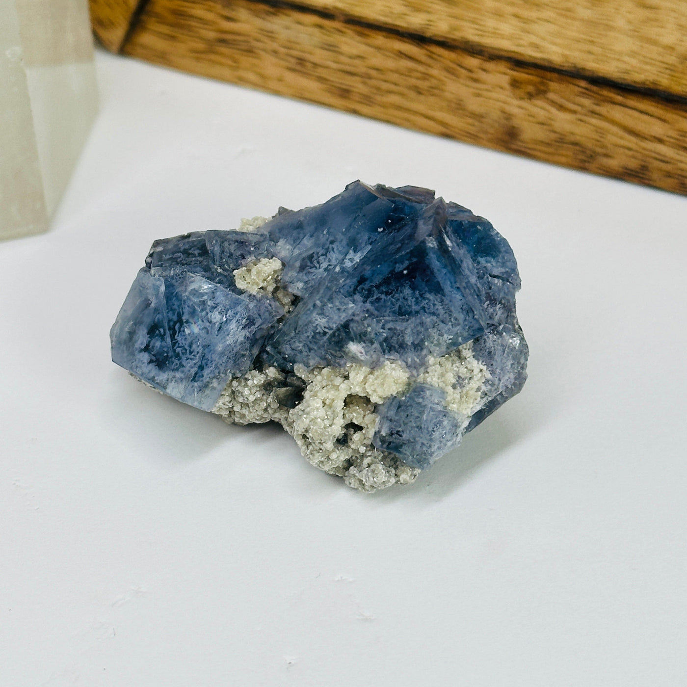 blue fluorite with decorations in the background