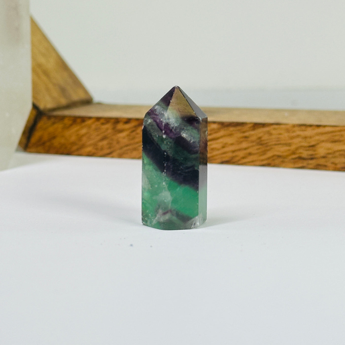 fluorite points with decorations in the background