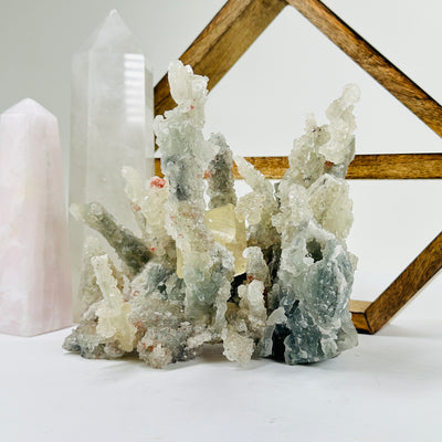 apophyllite with decorations in the background