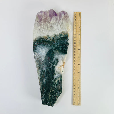 amethyst slab next to a ruler for size reference