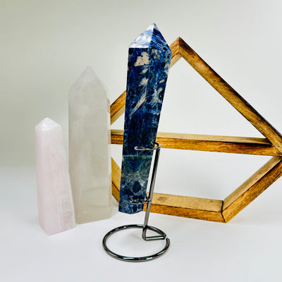 sodalite wand with decorations in the background