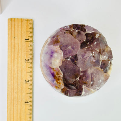 amethyst sphere with decorations in the background