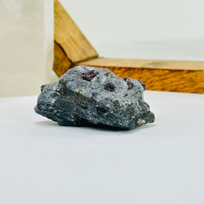 hematite with garnet with decorations in the background