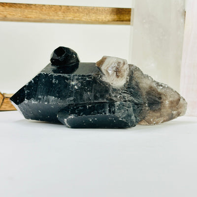 smokey quartz with decorations in the background