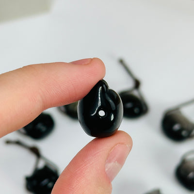 obsidian beads on white background